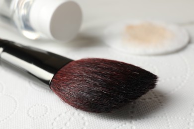 Photo of Makeup brush drying after cleaning on paper towel, closeup