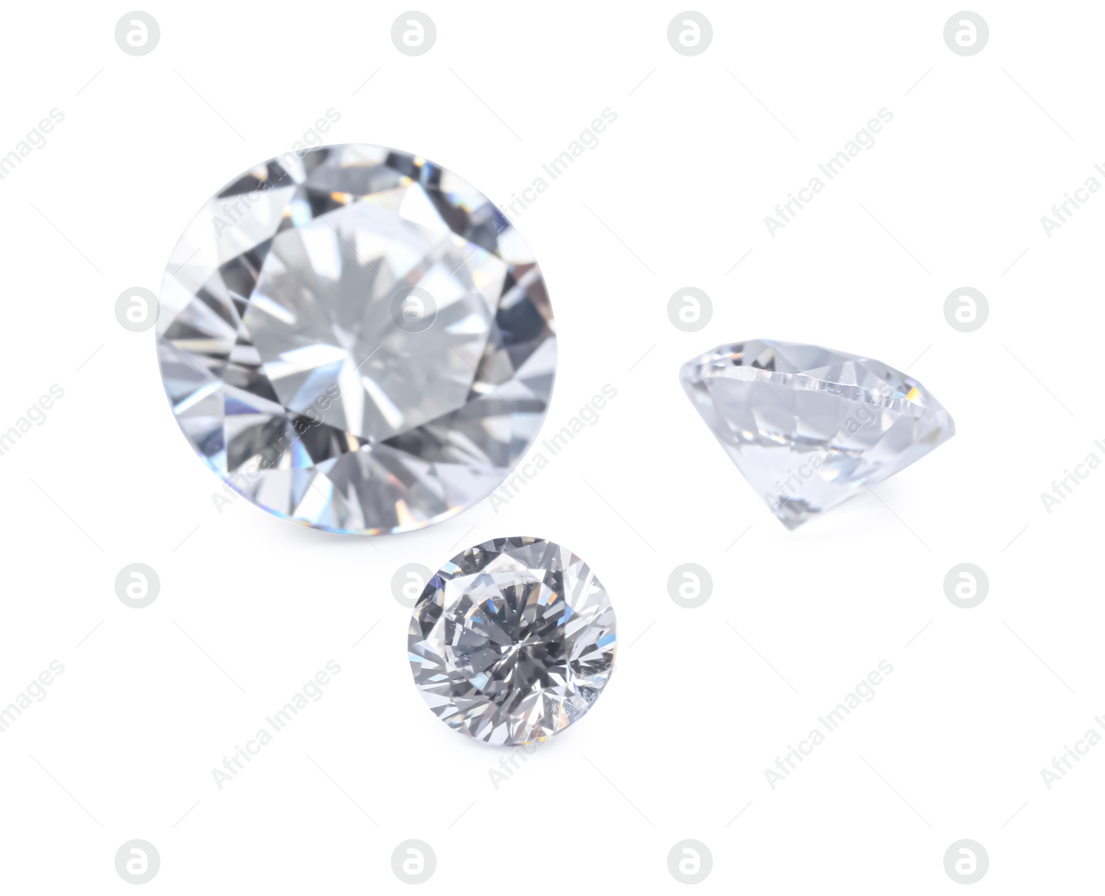 Photo of Different beautiful shiny diamonds isolated on white