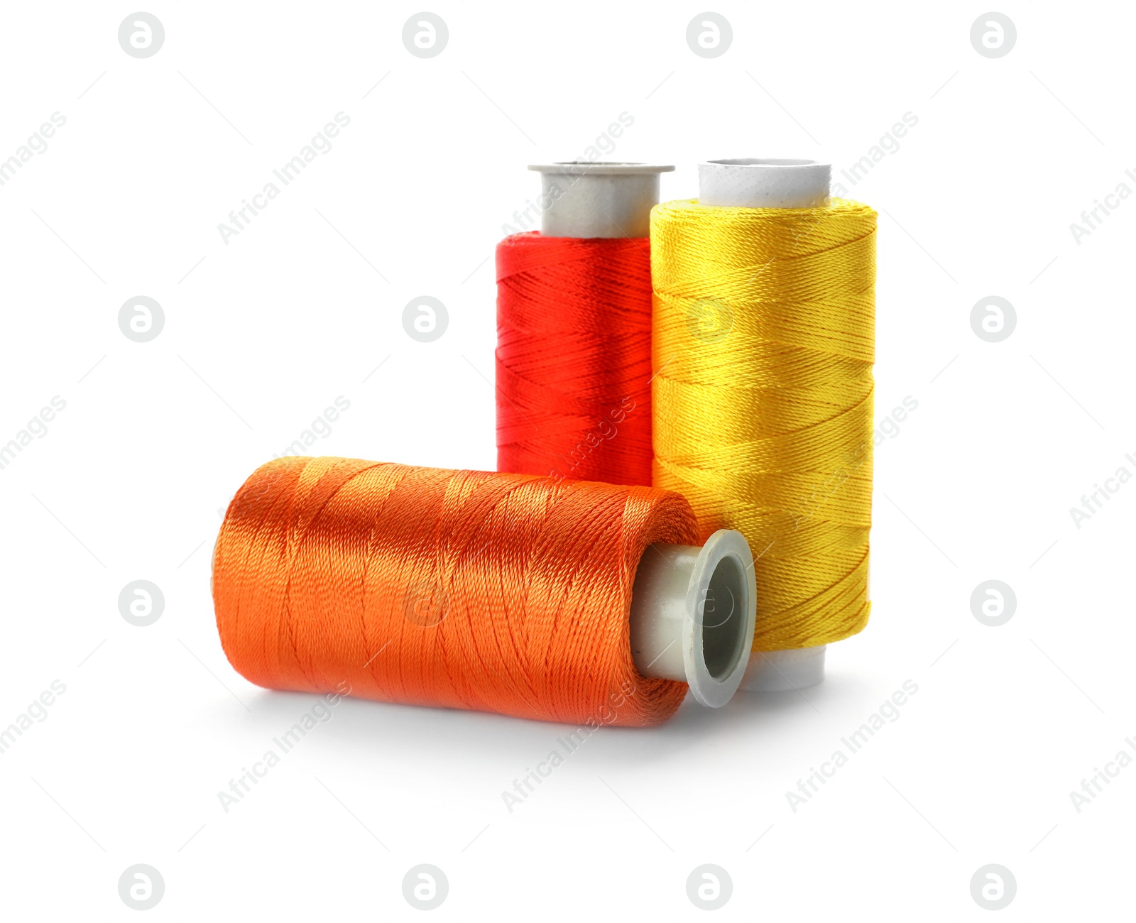 Photo of Color sewing threads on white background