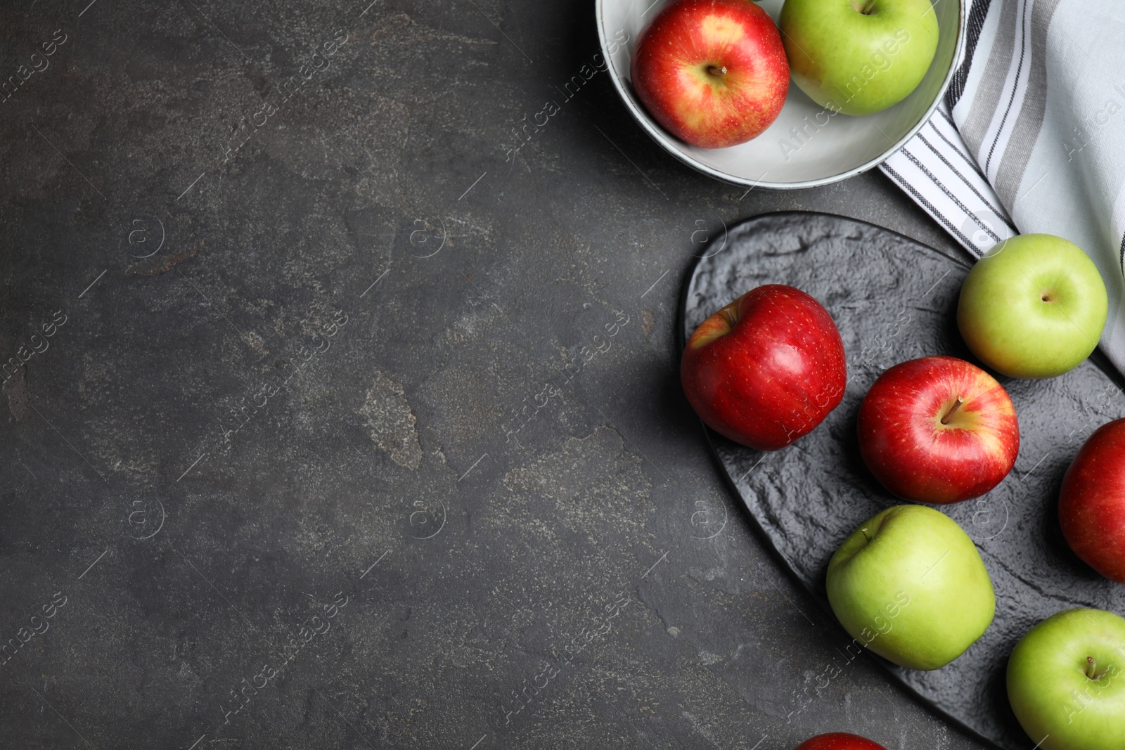Photo of Fresh ripe green apples on black table, flat lay. Space for text