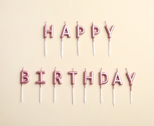 Photo of Flat lay composition with birthday candles on color background