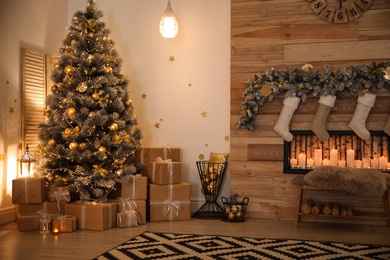 Stylish room interior with beautiful Christmas tree and decorative fireplace