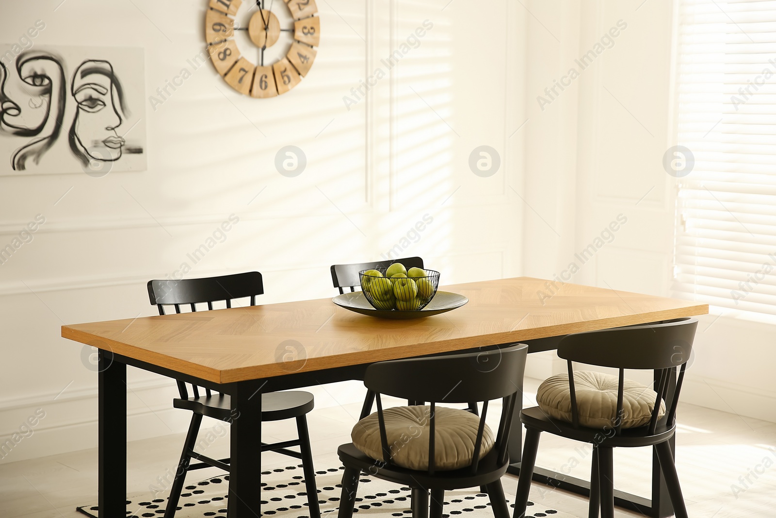 Photo of Stylish wooden dining table and chairs in room. Interior design