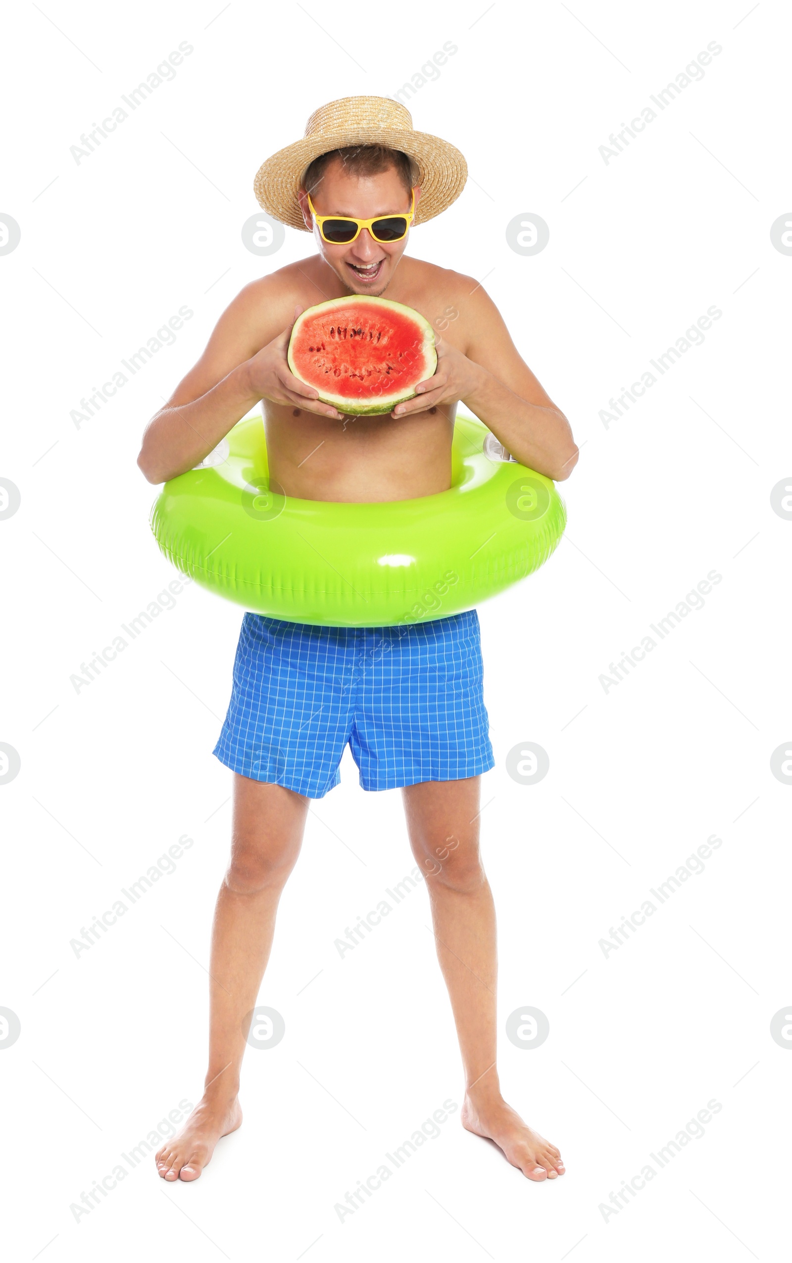 Photo of Shirtless man with inflatable ring and watermelon on white background