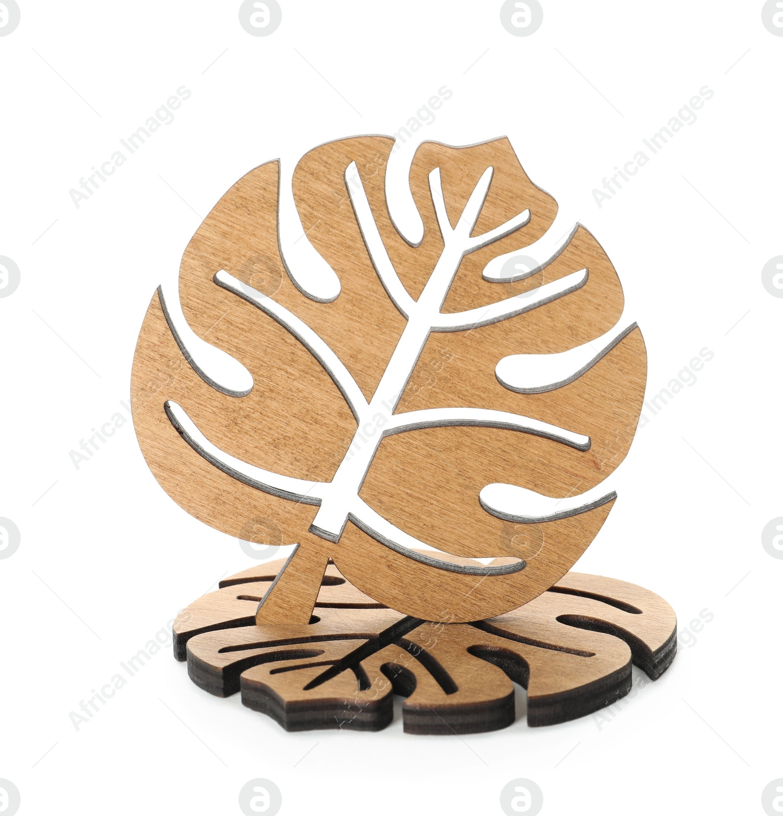 Photo of Leaf shaped wooden cup coasters on white background