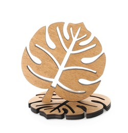 Leaf shaped wooden cup coasters on white background
