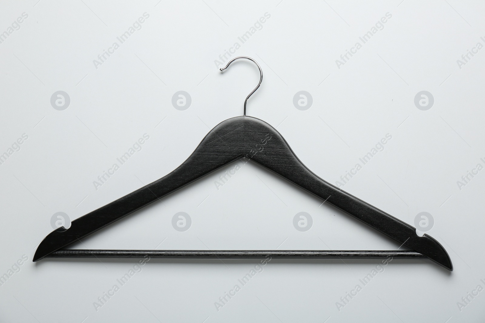 Photo of Black hanger on light gray background, top view