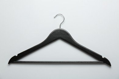 Photo of Black hanger on light gray background, top view
