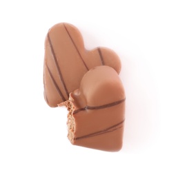 Delicious heart shaped chocolate candies on white background, top view