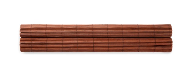 Photo of Rolled sushi mat made of bamboo on white background, top view