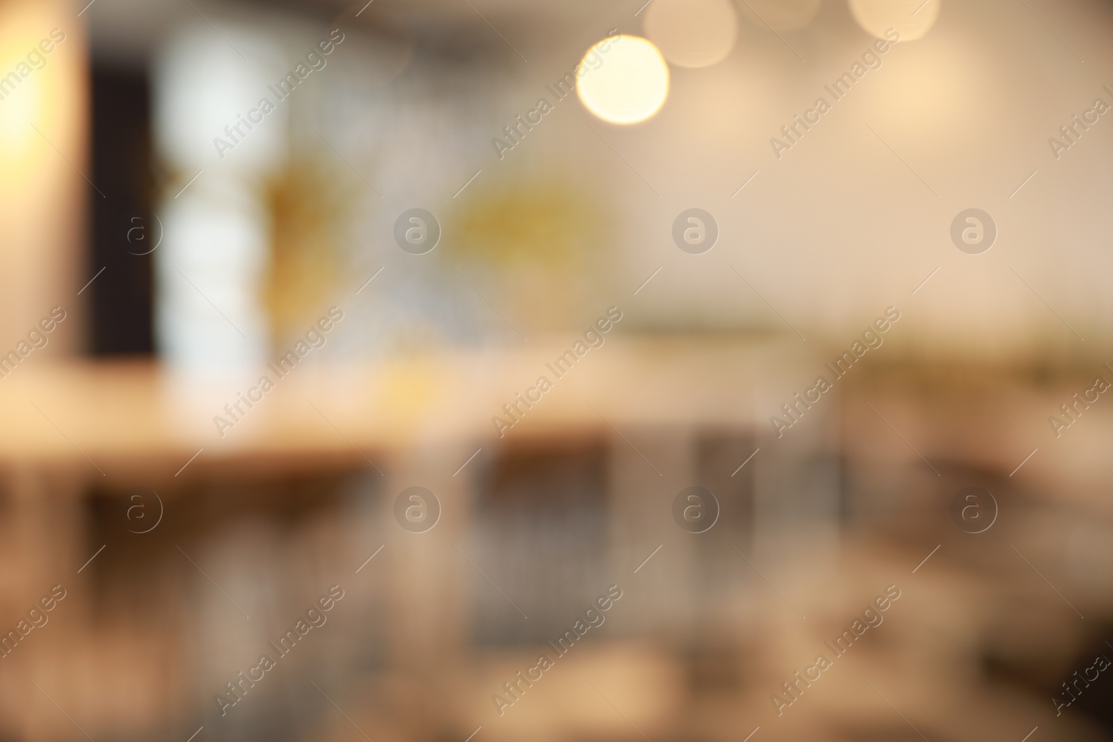 Photo of Blurred view of beautiful modern cafe interior