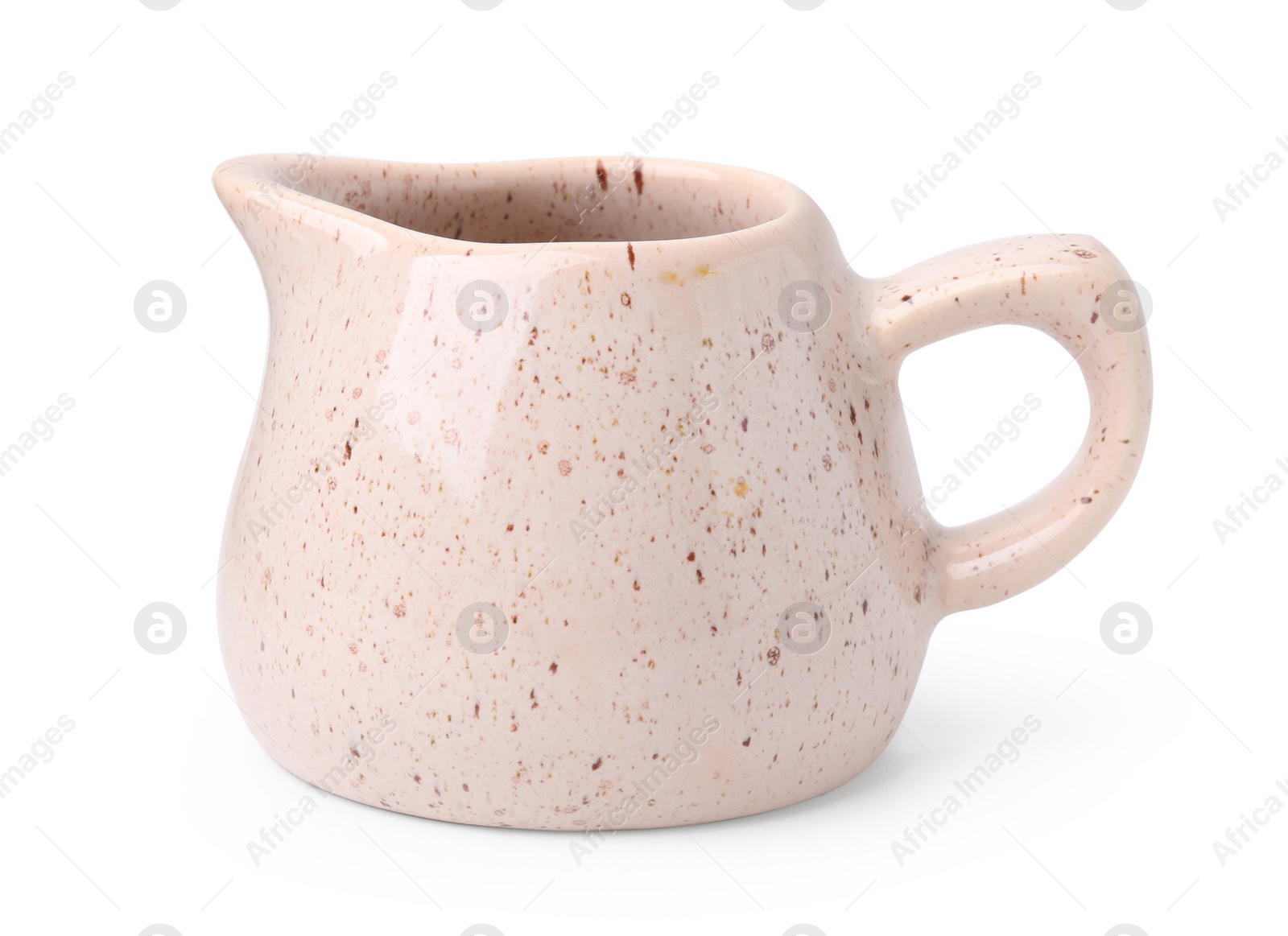 Photo of One ceramic creamer isolated on white. Cooking utensil