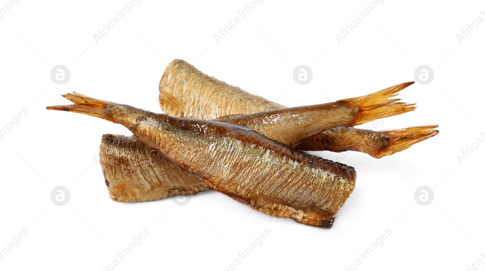 Photo of Many tasty smoked sprats isolated on white