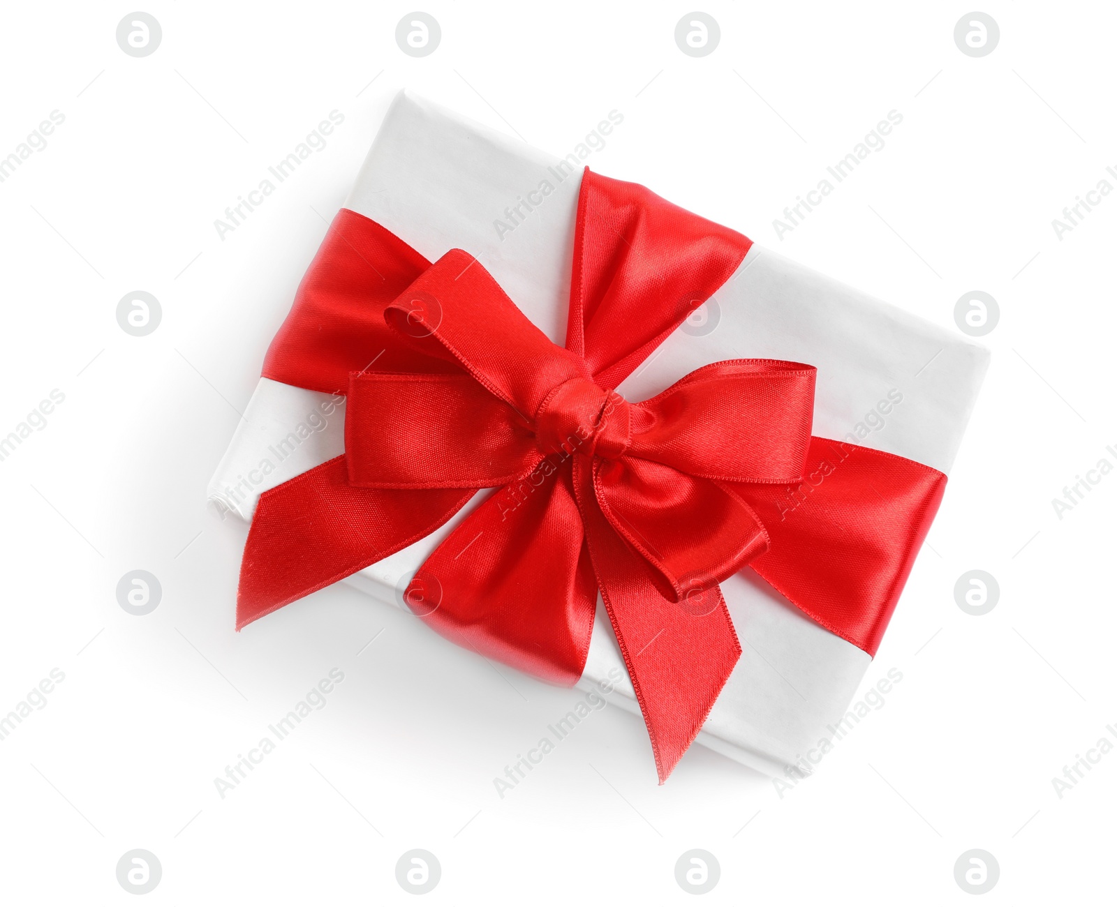 Photo of Beautifully wrapped gift box on white background, top view