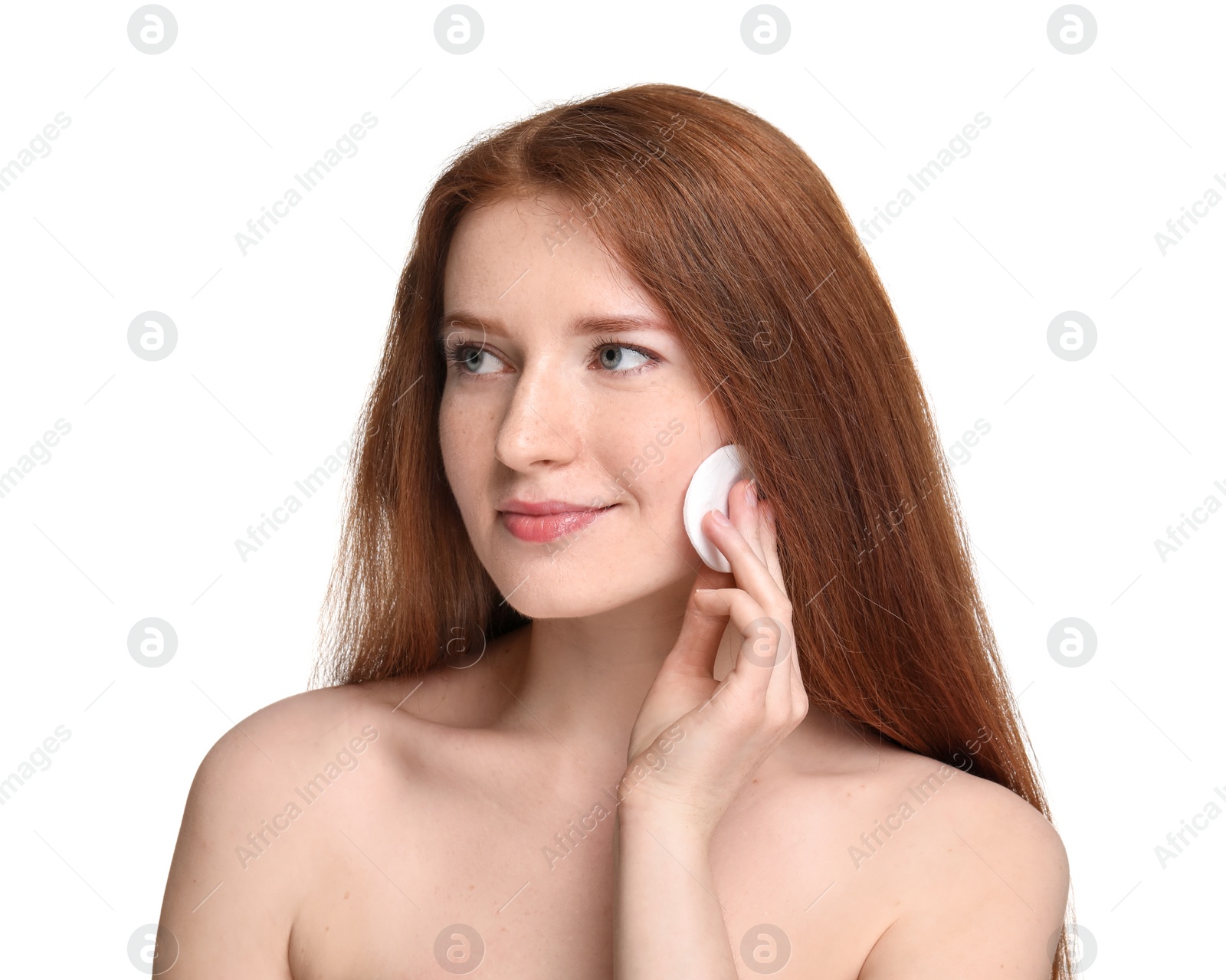 Photo of Beautiful woman with freckles wiping face on white background