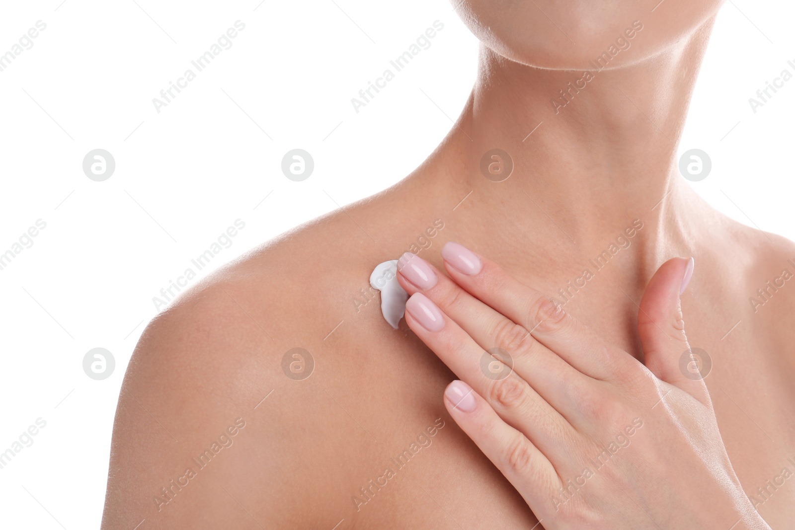 Photo of Young woman applying cream on white background, closeup. Beauty and body care