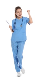 Photo of Full length portrait of emotional medical doctor with clipboard isolated on white