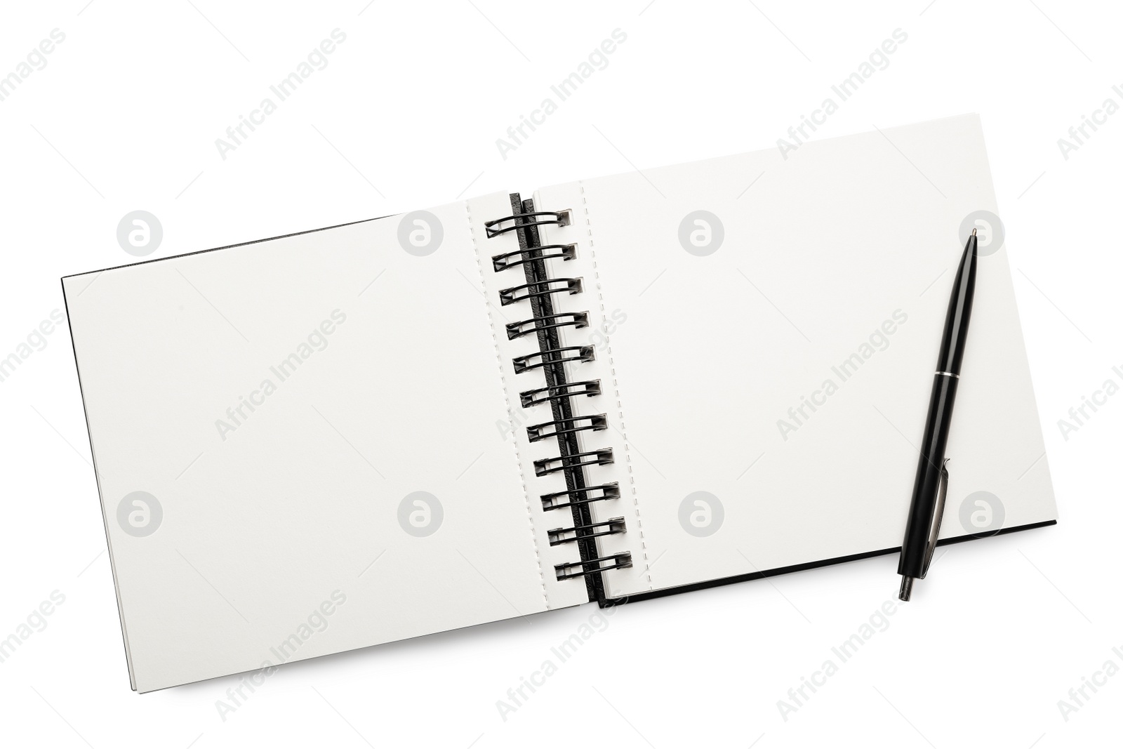 Photo of Open empty notebook and pen isolated on white, top view