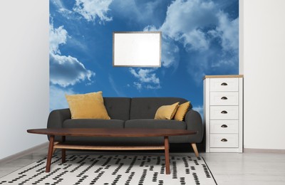 Pattern of blue sky with clouds on wallpaper in furnished room. Beautiful living room Interior