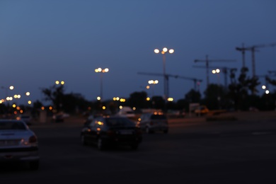 Photo of Blurred view of beautiful city in evening