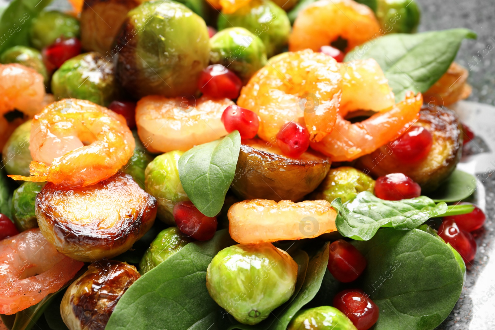 Photo of Warm salad with Brussels sprouts on plate, closeup