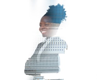 Double exposure of businesswoman and cityscape with office buildings