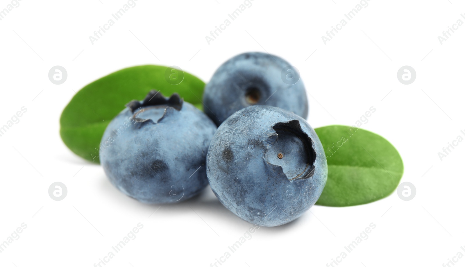 Photo of Delicious fresh ripe blueberries with leaves isolated on white