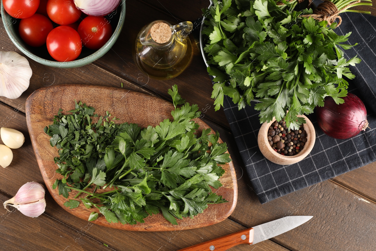 Photo of Fresh green parsley and different products on wooden table, flat lay