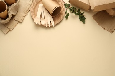 Flat lay composition with eco friendly products on beige background, space for text