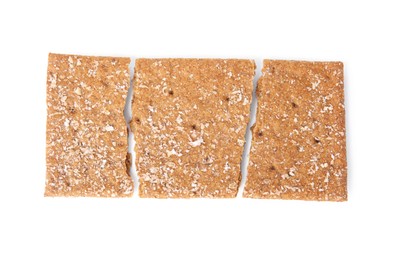 Photo of Fresh broken rye crispbread isolated on white, top view