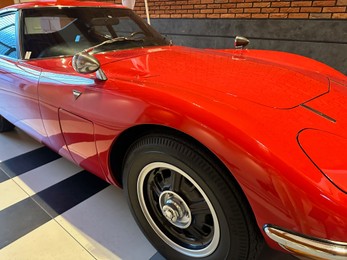 Photo of Hague, Netherlands - November 8, 2022: Beautiful view of red retro car in Louwman museum