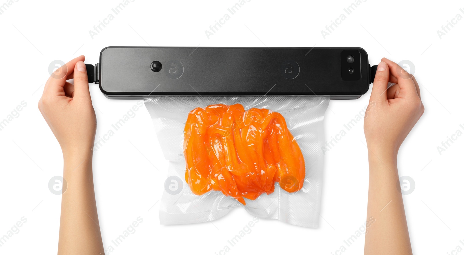 Photo of Woman using sealer for vacuum packing with plastic bag of bell pepper on white background, top view