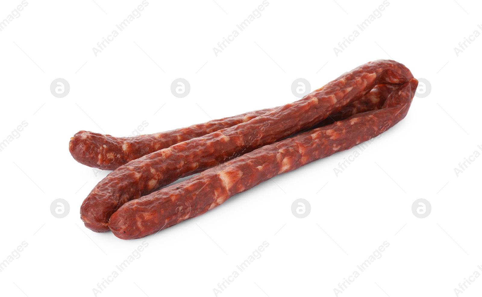 Photo of Thin dry smoked sausages isolated on white