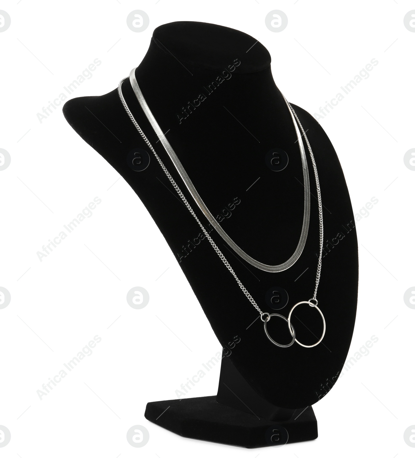 Photo of Stylish silver necklace on jewelry bust against white background