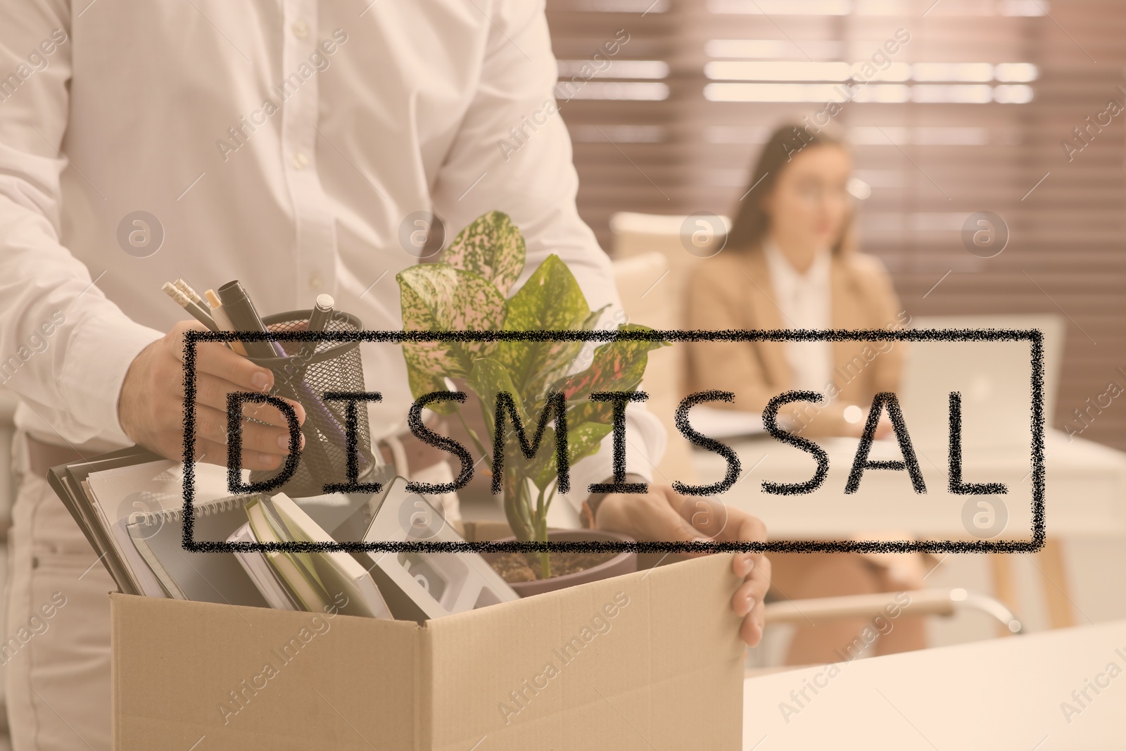 Image of Dismissed man packing personal stuff into box in office, closeup