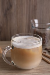 Photo of Cup of fresh coffee on wooden table