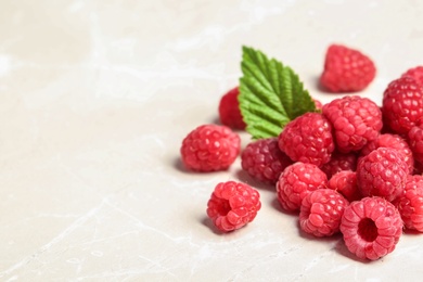 Photo of Ripe aromatic raspberries on table, closeup