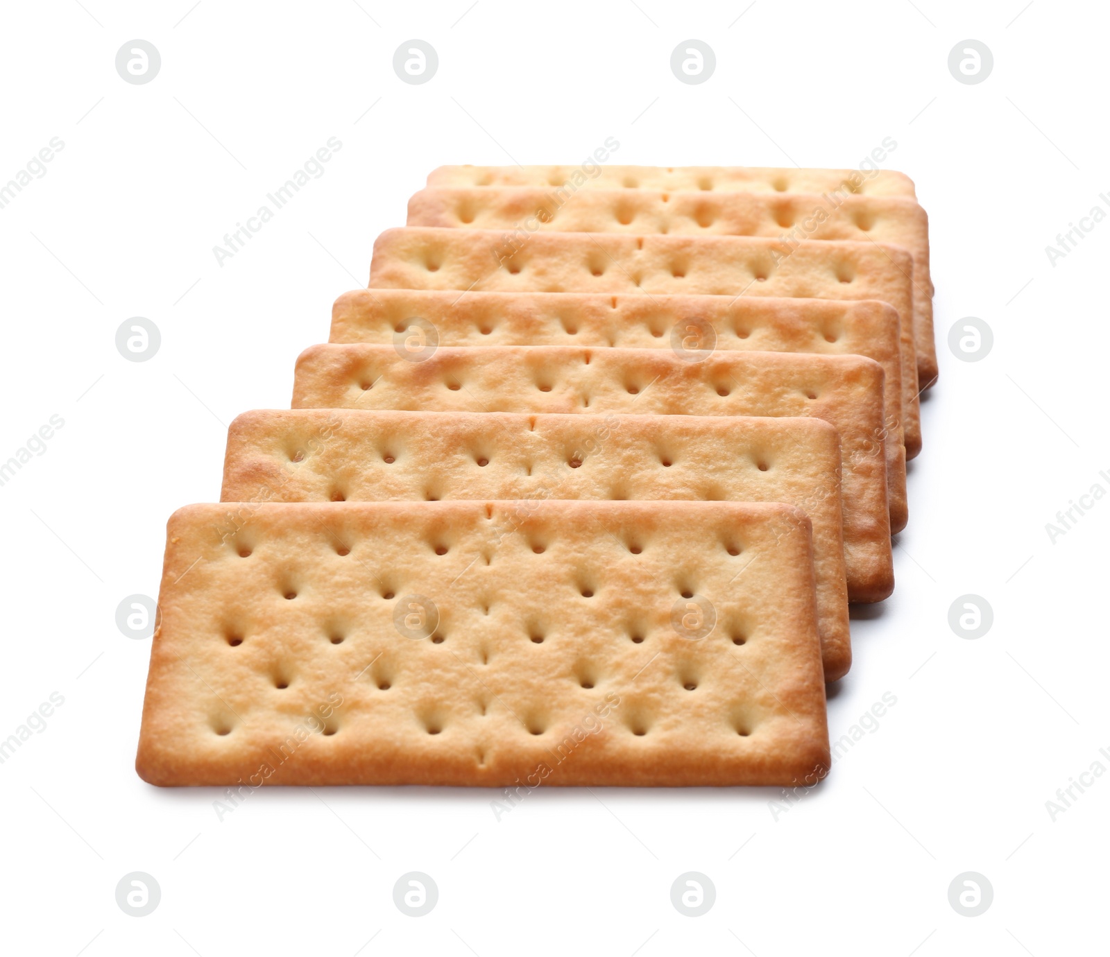 Photo of Crispy crackers isolated on white. Delicious snack