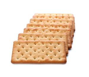 Photo of Crispy crackers isolated on white. Delicious snack