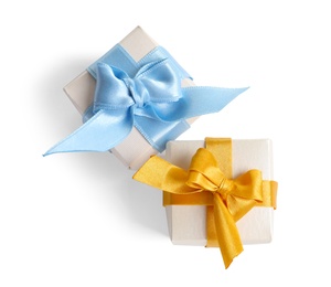 Photo of Beautifully wrapped gift boxes on white background, top view