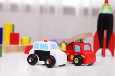 Different toys on white table in kindergarten, closeup