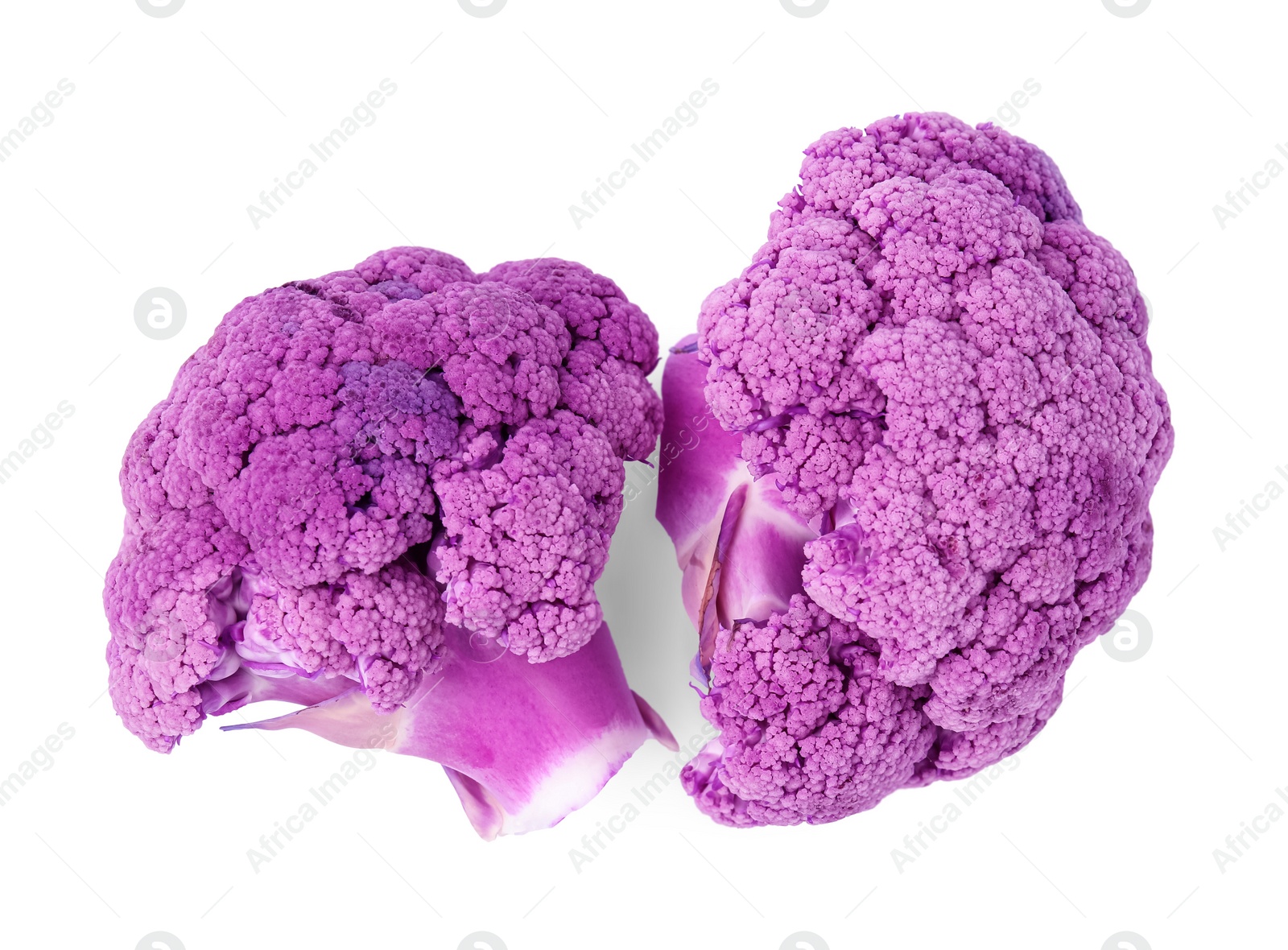 Photo of Cut purple cauliflowers on white background, top view. Healthy food