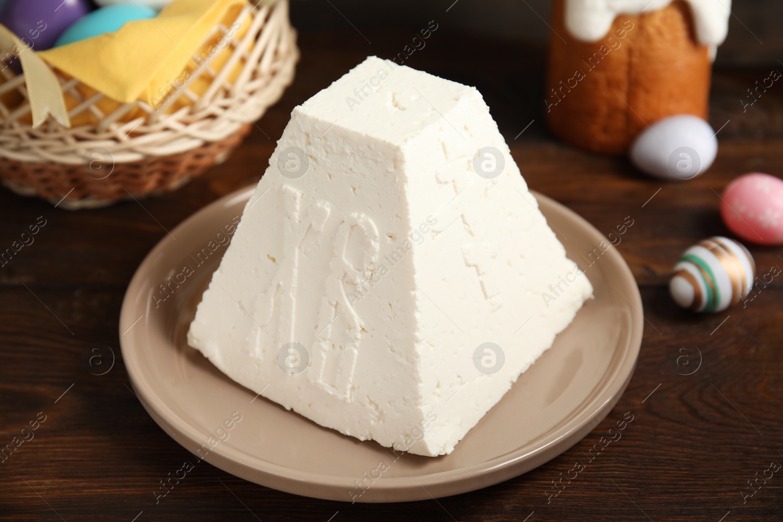 Photo of Traditional cottage cheese Easter paskha on wooden table