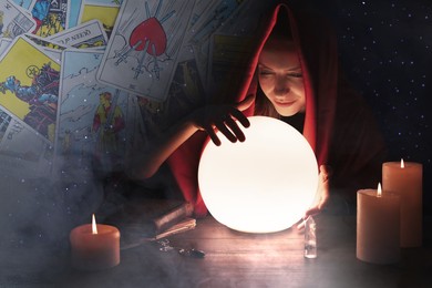Image of Double exposure with tarot cards and photo of soothsayer using crystal ball