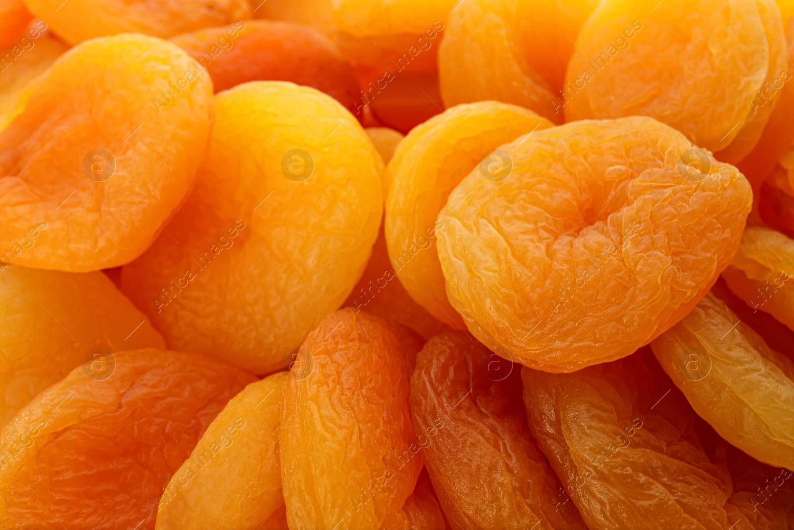 Photo of Tasty dried apricots as background, closeup. healthy snack