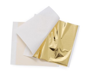Photo of Edible gold leaf sheets on white background, top view