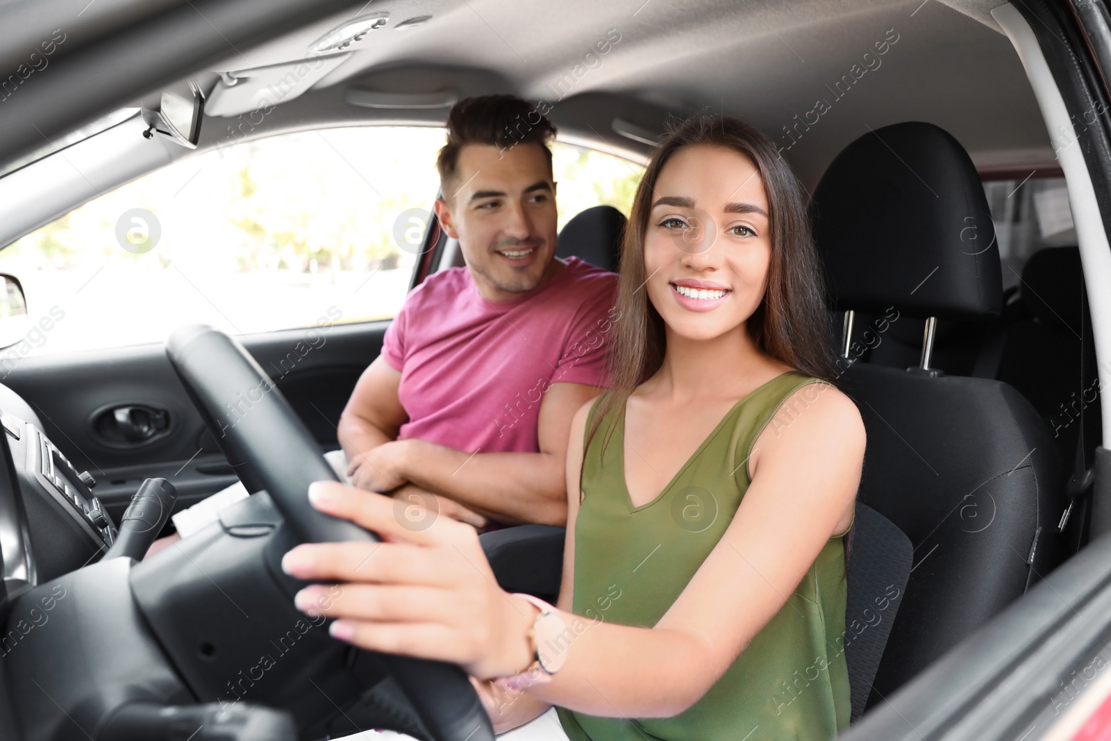 Photo of Happy young couple in car on road trip
