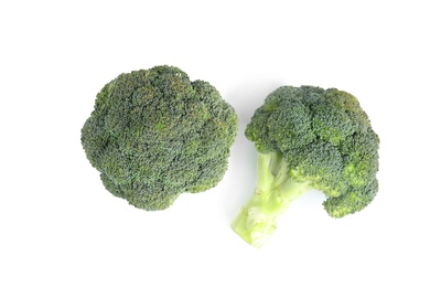 Photo of Fresh green broccoli on white background, top view. Organic food