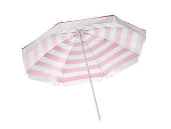 Photo of Open red striped beach umbrella isolated on white