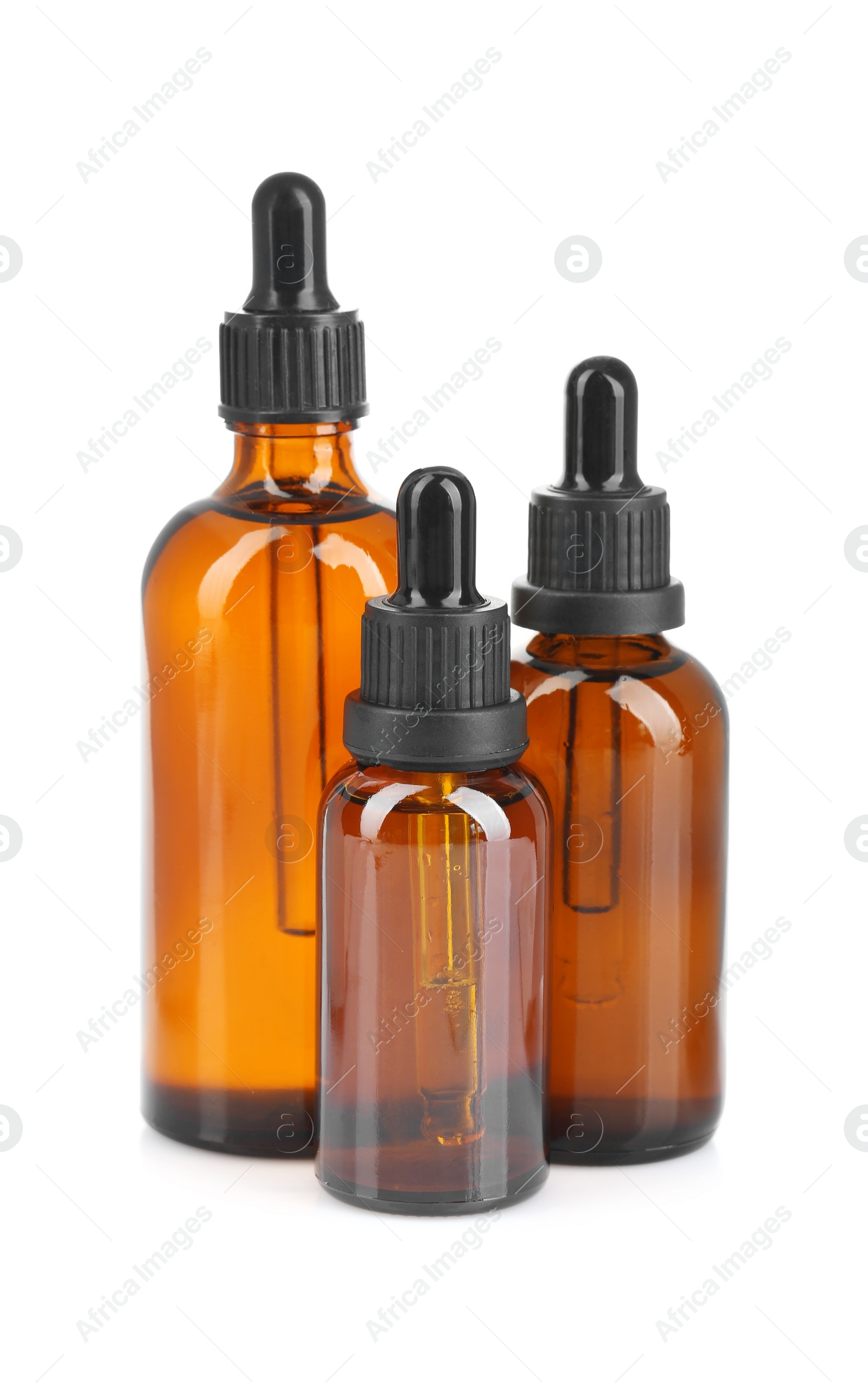 Photo of Glass bottles of tincture isolated on white